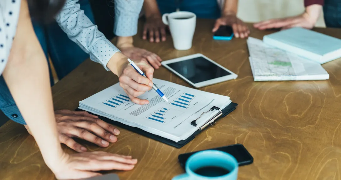 A close up of a team looking at financial information