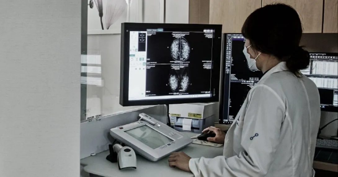 Doctor reviewing mammography findings from AI-powered software